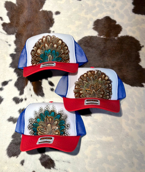 RED WHITE AND BLUE FEATHER TRUCKER HAT
